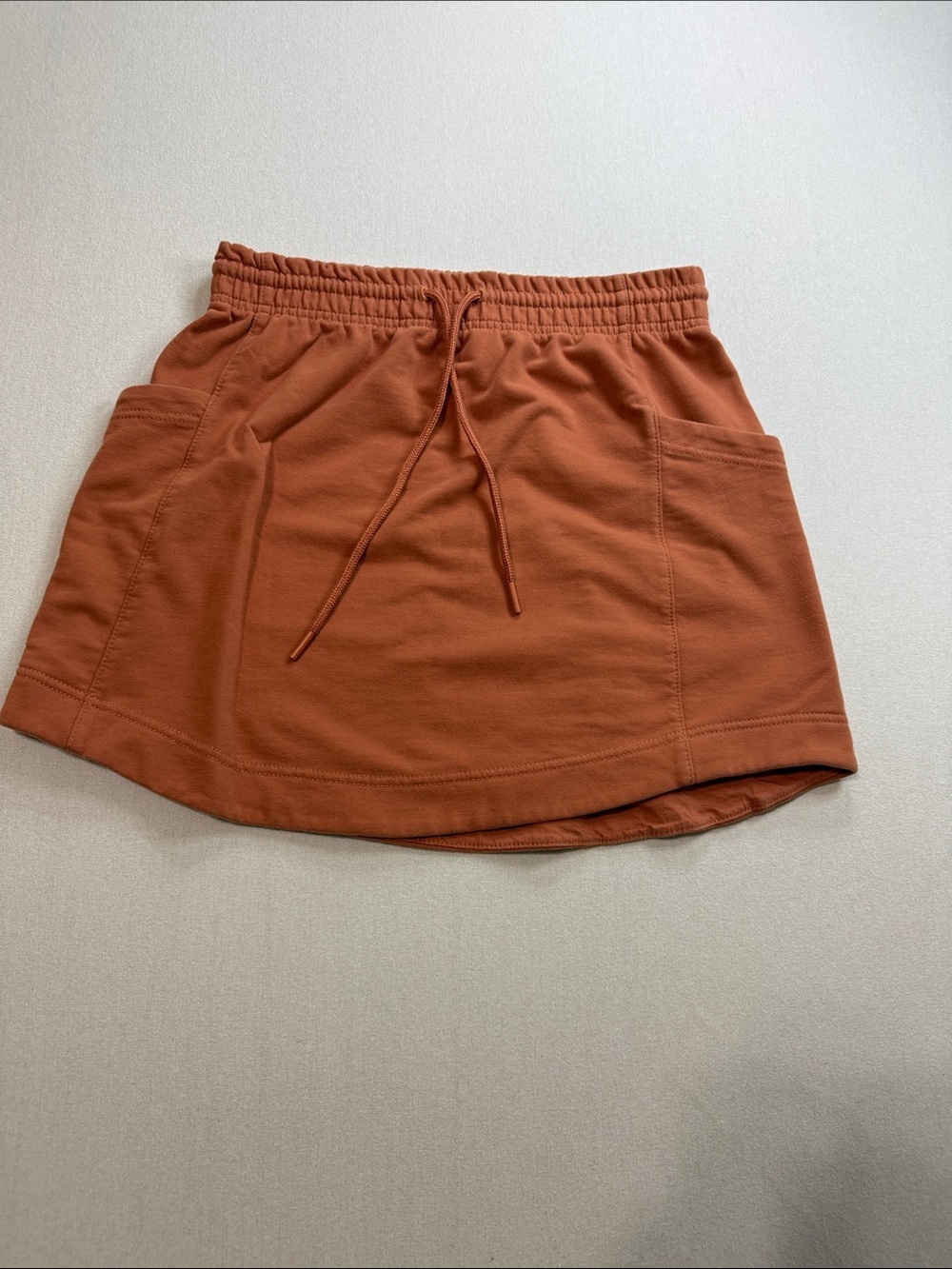 Athleta Rust Mini Skirt with Drawstring Pockets